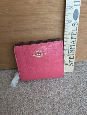 Coach Pink Pebbled Leather Bifold Wallet with Gold Logo